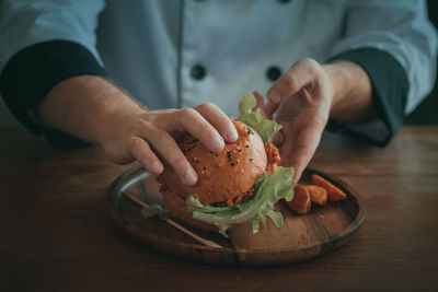 Close-up of man preparing food