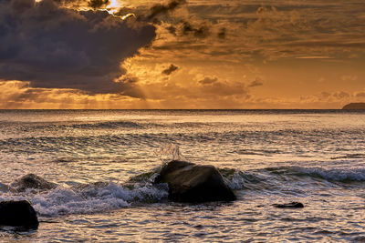 Scenic view of sea against sky during sunset