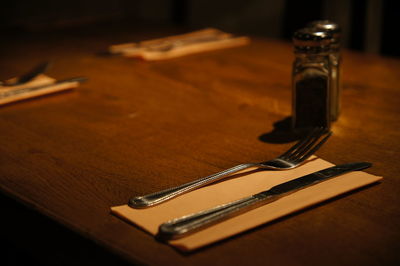 High angle view of forks and knife on table 