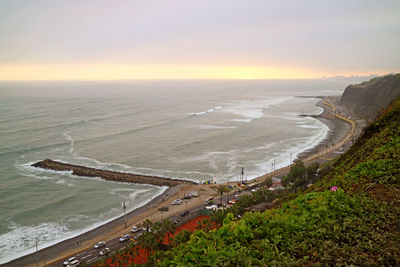 High angle view of beach against sky during sunset