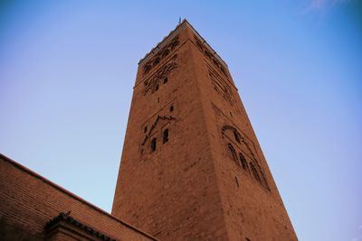 Low angle view of historical building against blue sky