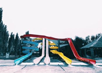 View of playground against clear sky during winter