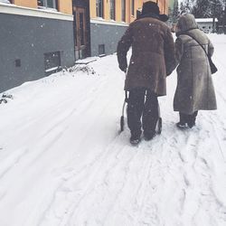 Woman covering face covered with snow