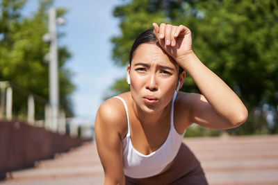 Young woman exercising in gym