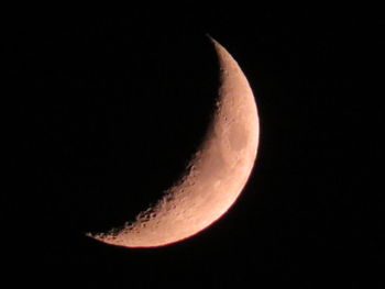 Low angle view of moon against sky at night