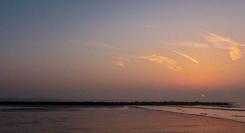 Scenic view of sea at sunset