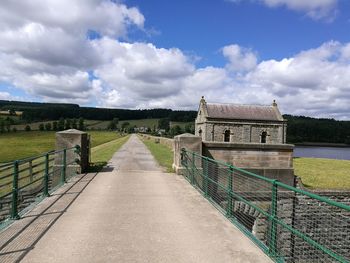 Narrow walkway leading to bridge