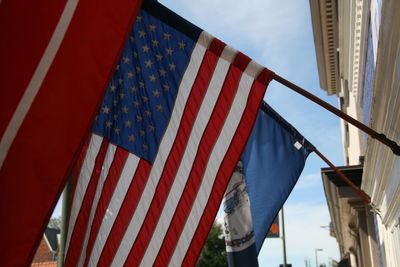 Low angle view of flag against sky