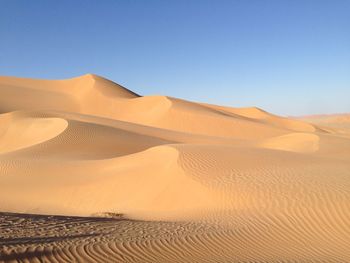 Scenic view of desert against clear sky