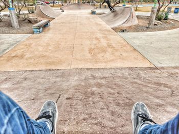 Low section of man standing on floor