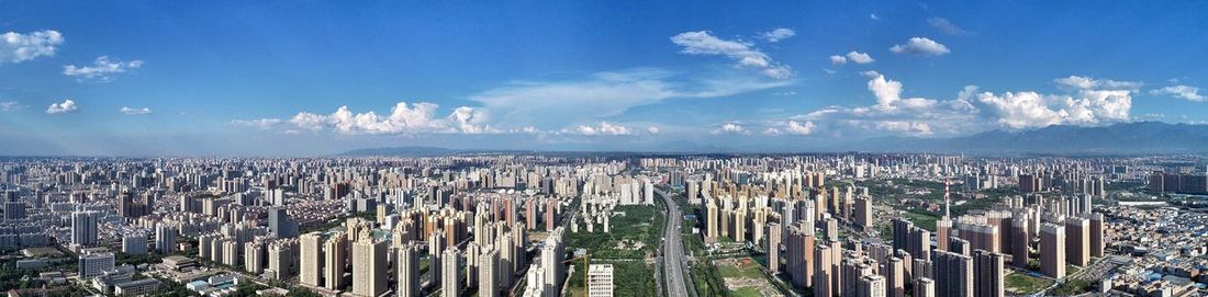 Panoramic shot of cityscape against sky