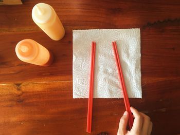 High angle view of hand on table