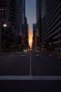 View of city street during sunset