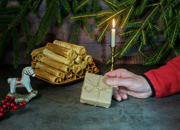 Christmas waffles-a tube of cream on a christmas background. festive atmosphere with christmas ligh