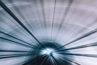 Low angle view of illuminated tunnel