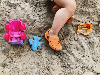 Low section of baby on sand