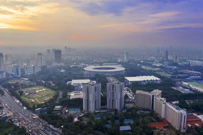 High angle view of city buildings during sunset