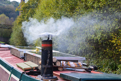 Scenic view of smoke from a canal boat chimney