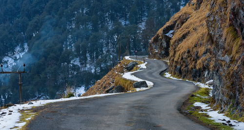 Road amidst snow covered mountain