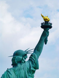 Low angle view of statue against sky