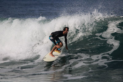 Man surfing in sea