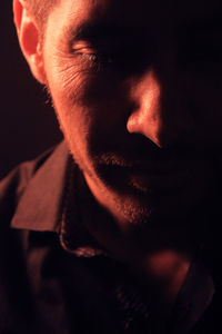 Close-up of man in dark