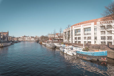 Boats moored at harbor