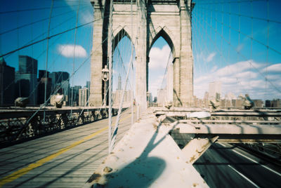 View of bridge and buildings against sky