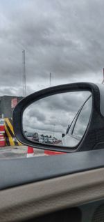 Close-up of side-view mirror of car