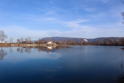 Scenic view of lake against blue sky