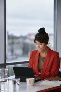 Businesswoman using tablet in office