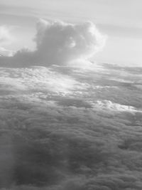 Aerial view of landscape against cloudy sky