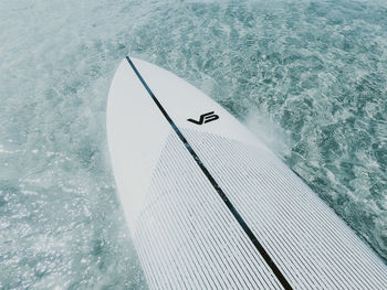 High angle view of white umbrella by sea
