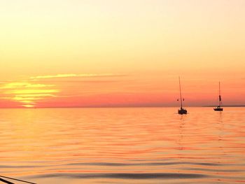 Scenic view of sunset over calm sea