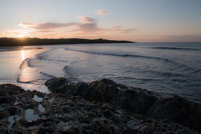 Scenic view of sea at sunset