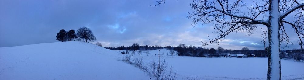 Scenic view of snow covered landscape against sky