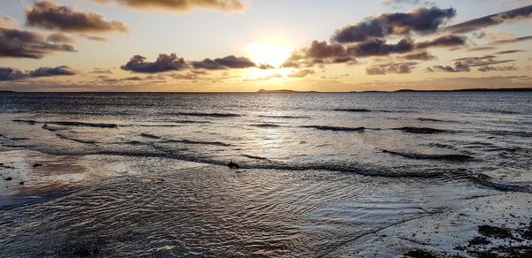 Scenic view of sea against sky during sunset