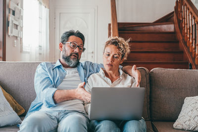 Woman using laptop at home