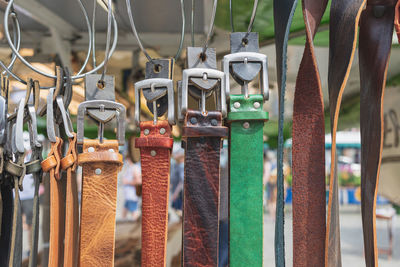 Close-up of clothes hanging at market stall