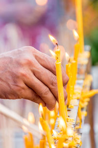 Close-up of hand holding cross