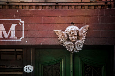 Statue against wall