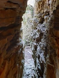 Low angle view of stone wall in cave