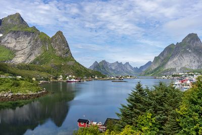 Scenic view of lake and mountains against sky