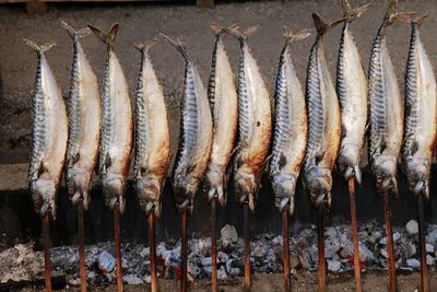 Panoramic shot of fish on barbecue grill