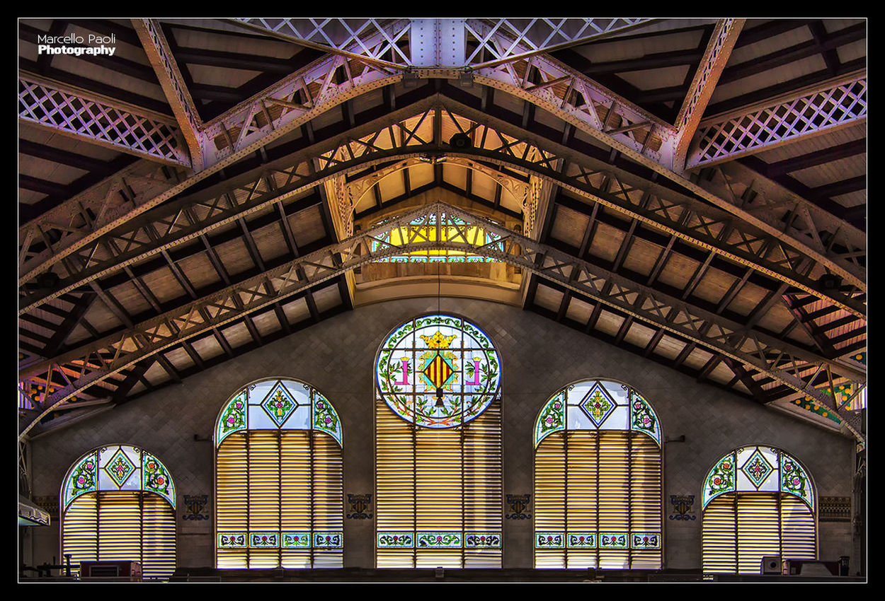 architecture, built structure, indoors, low angle view, arch, stained glass, pattern, ceiling, architectural feature, design, famous place, window, transfer print, interior, ornate, travel destinations, building exterior, no people, illuminated, travel