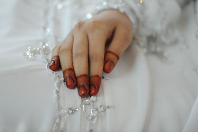 Close-up of bride hand