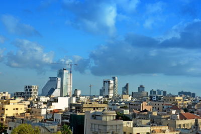 Buildings in city against sky