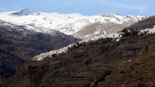 Scenic view of snow covered mountains