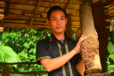 Portrait of young man standing outdoors