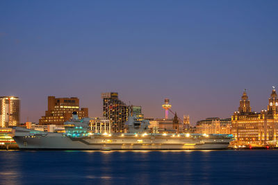 Illuminated buildings in city at night